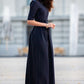 Black classic maxi dress with pleats and separated belt
