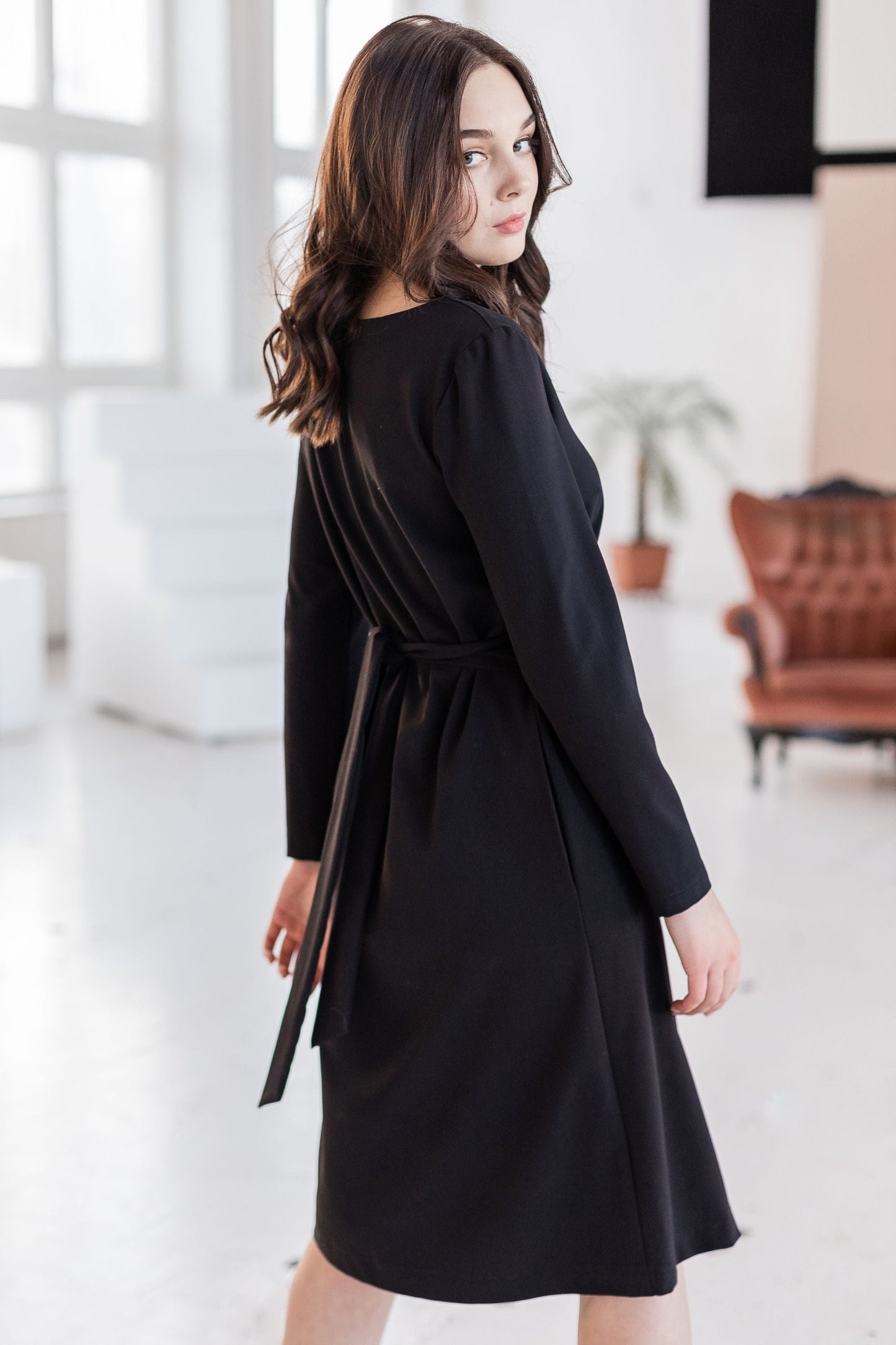 Black classic, loose-fitting dress with a belt