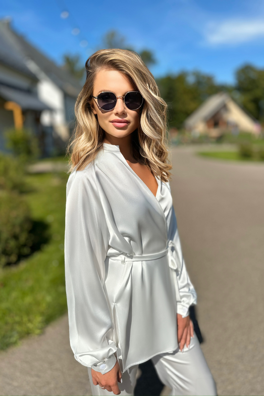 Loose cut satin blouse with a belt at the waist