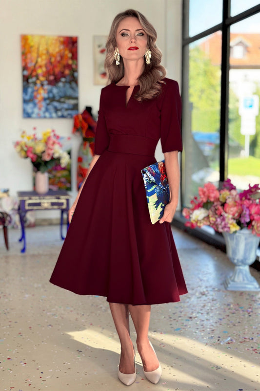 Dark red midi dress with circle skirt, gold neckline detail - front view