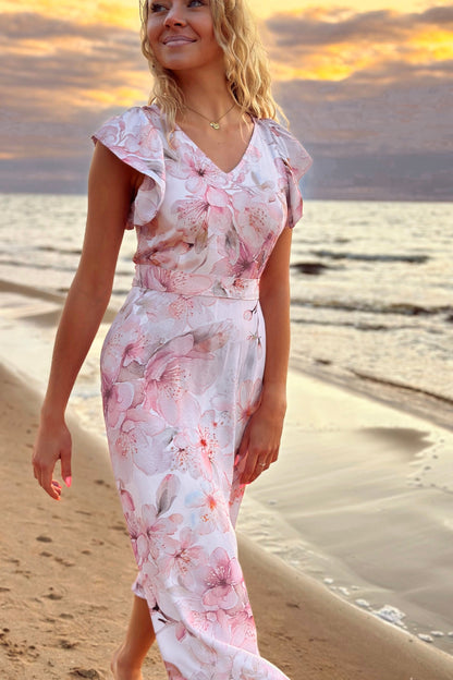 Pink floral viscose dress, front view on the beach
