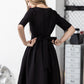 Black dress with pleats