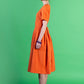Orange dress with pleats