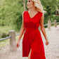 Red half-length cocktail dress with a bow