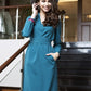 Blue green dress with side pockets and belt