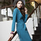 Blue green dress with side pockets and belt
