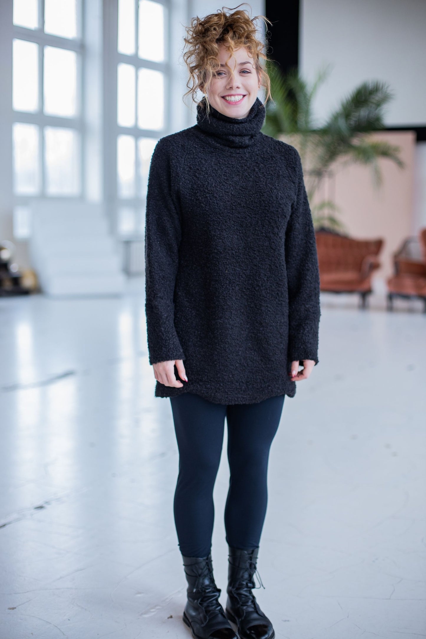 Black half-length sweater made of wool fabric
