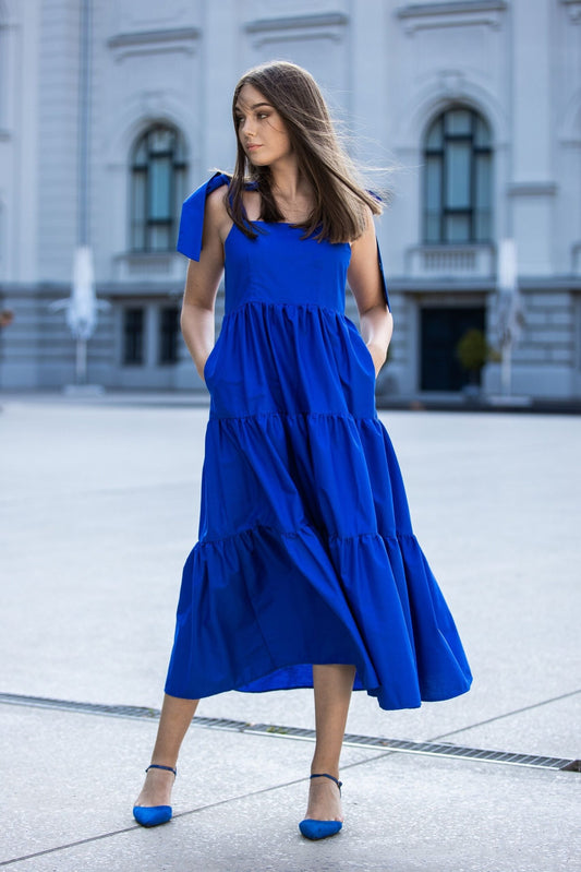 Blue organic cotton dress with bows