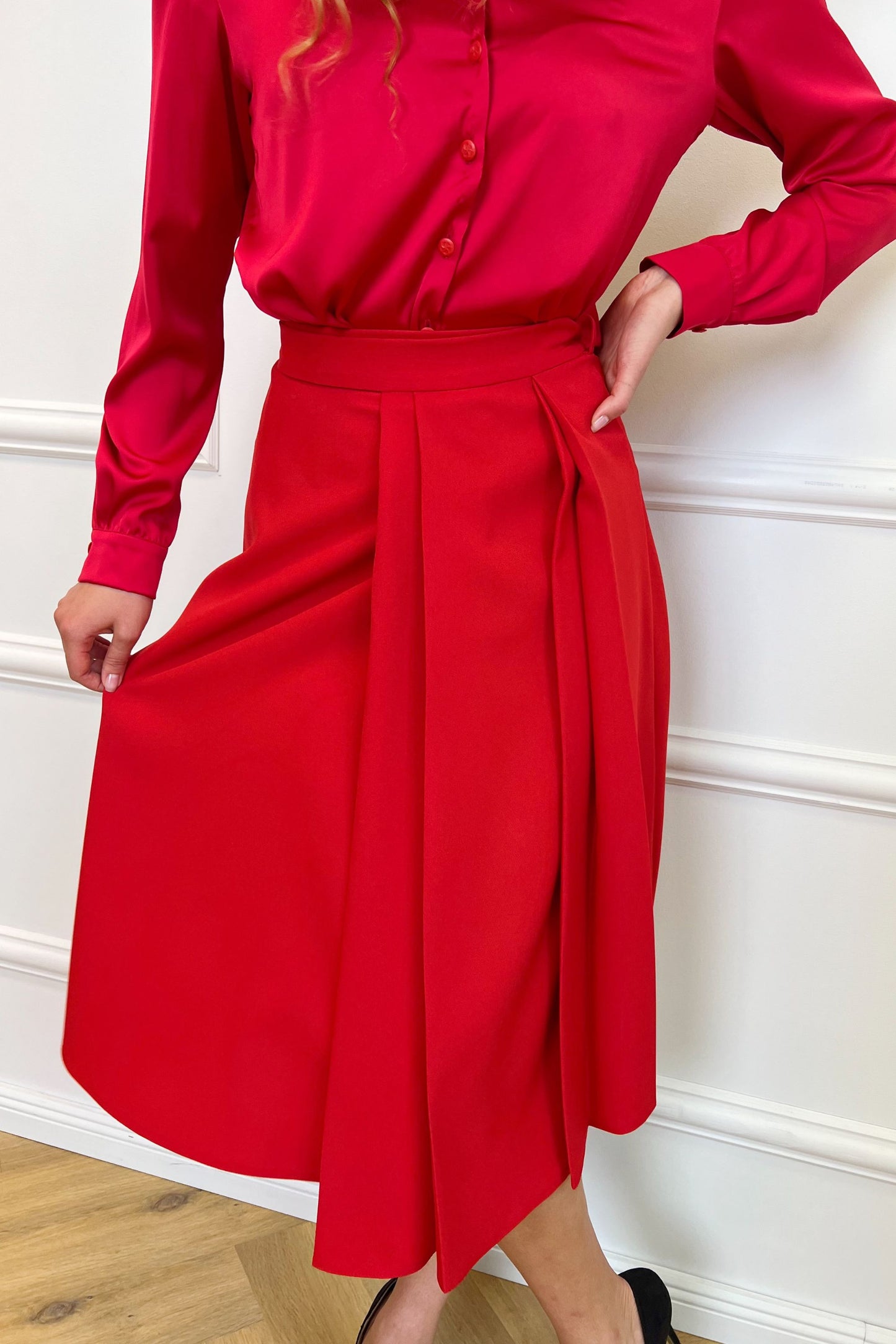 Red skirt with pleats on one side