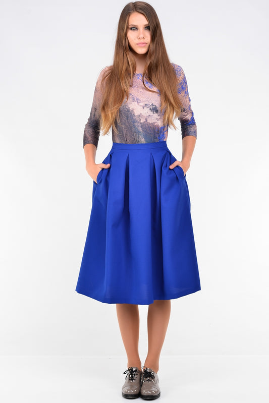 Blue knee length skirts with pleats and pockets