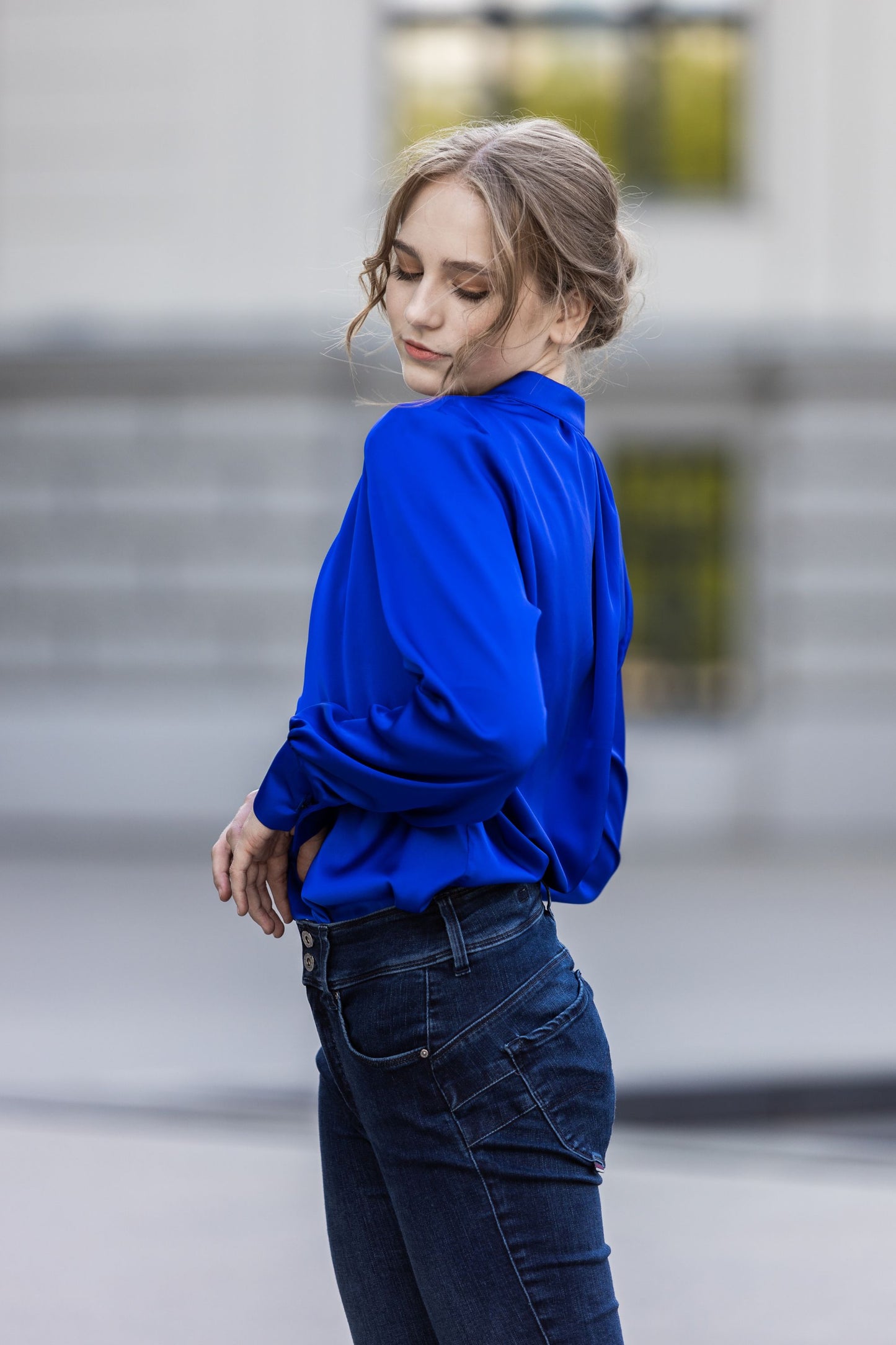 Bright blue satin blouse with V cut
