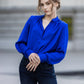 Bright blue satin blouse with V cut