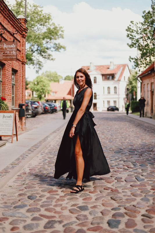 Black dress with a circle skirt and a tie bow