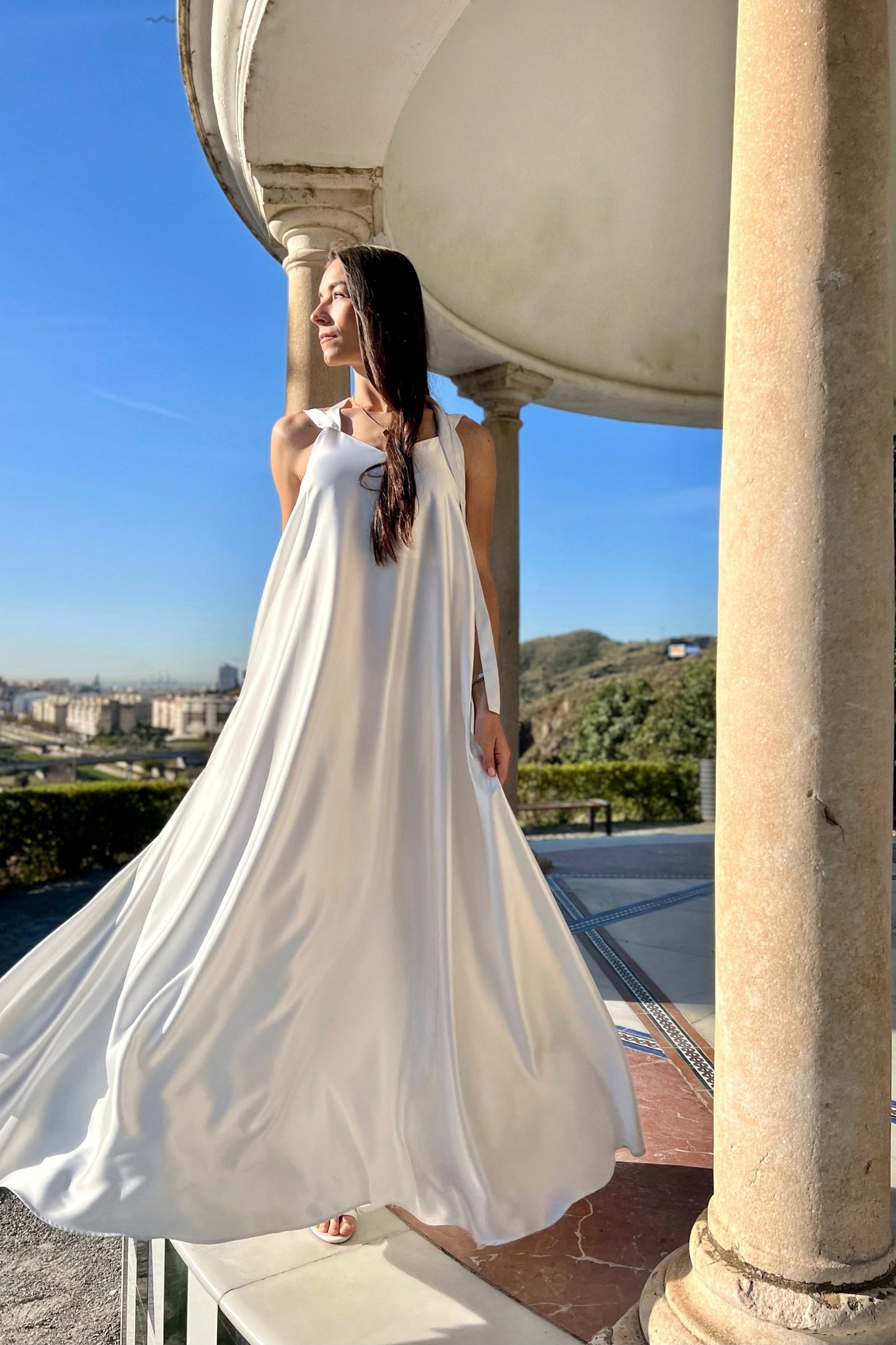 Sleeveless white maxi dress with open back
