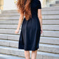 Black dress with pleats in skirt part