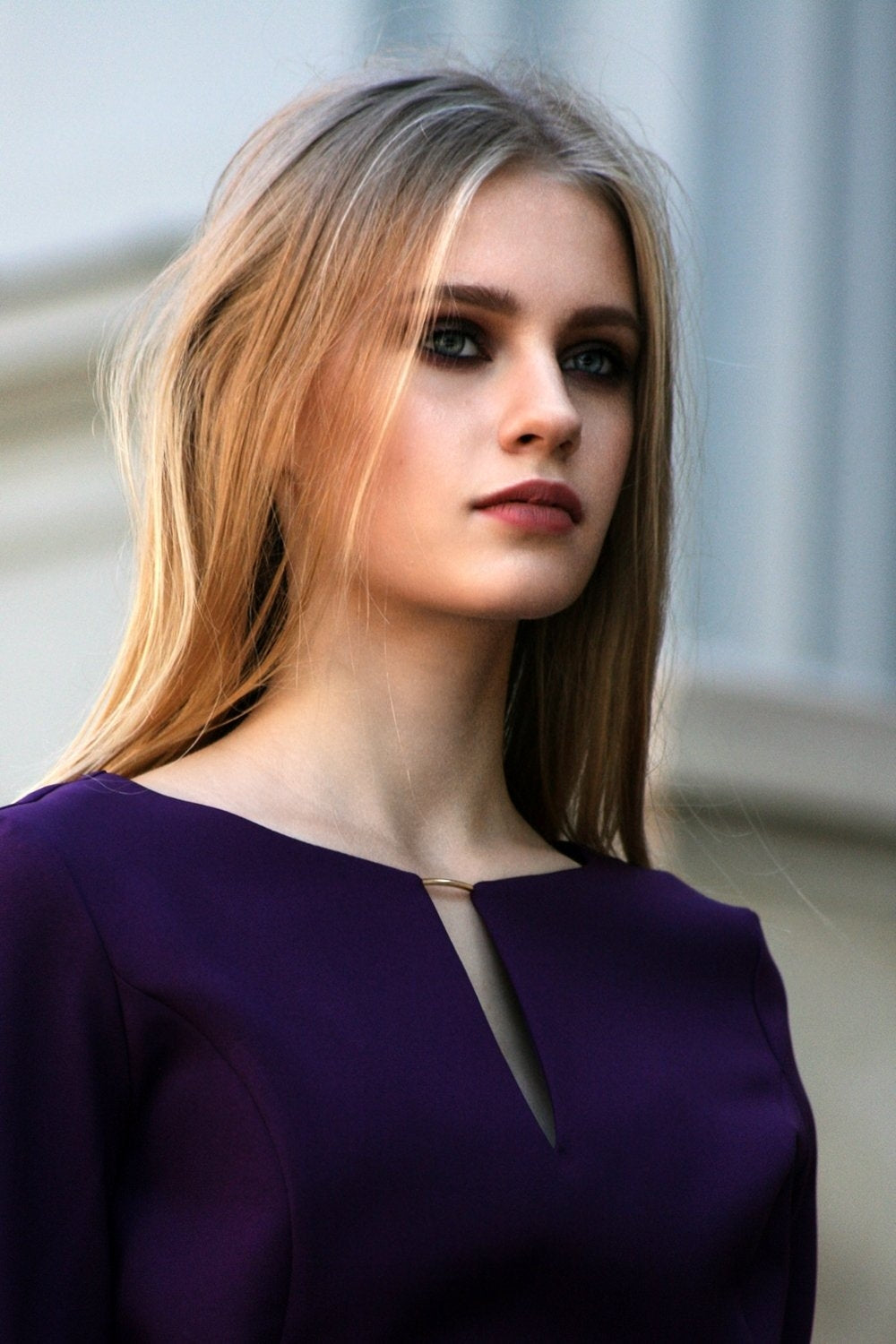 Dark purple dress with circle skirts. Golden color detail in neckline