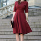 Dark red dress with circle skirts. Golden color detail in neckline