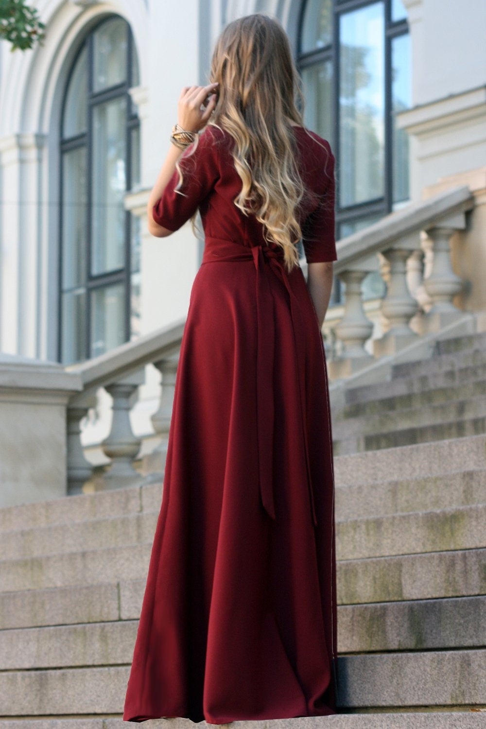 Dark red maxi dress with circle skirts. Golden color detail in necklin GUNTINA Dark red maxi dress with circle skirts. Golden color detail in necklin GUNTINA