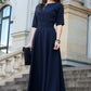 Dark blue maxi dress with circle skirts. Golden color detail in neckline