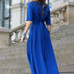 Blue maxi dress with circle skirts. Golden color detail in neckline