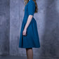 Blue green dress with pleats