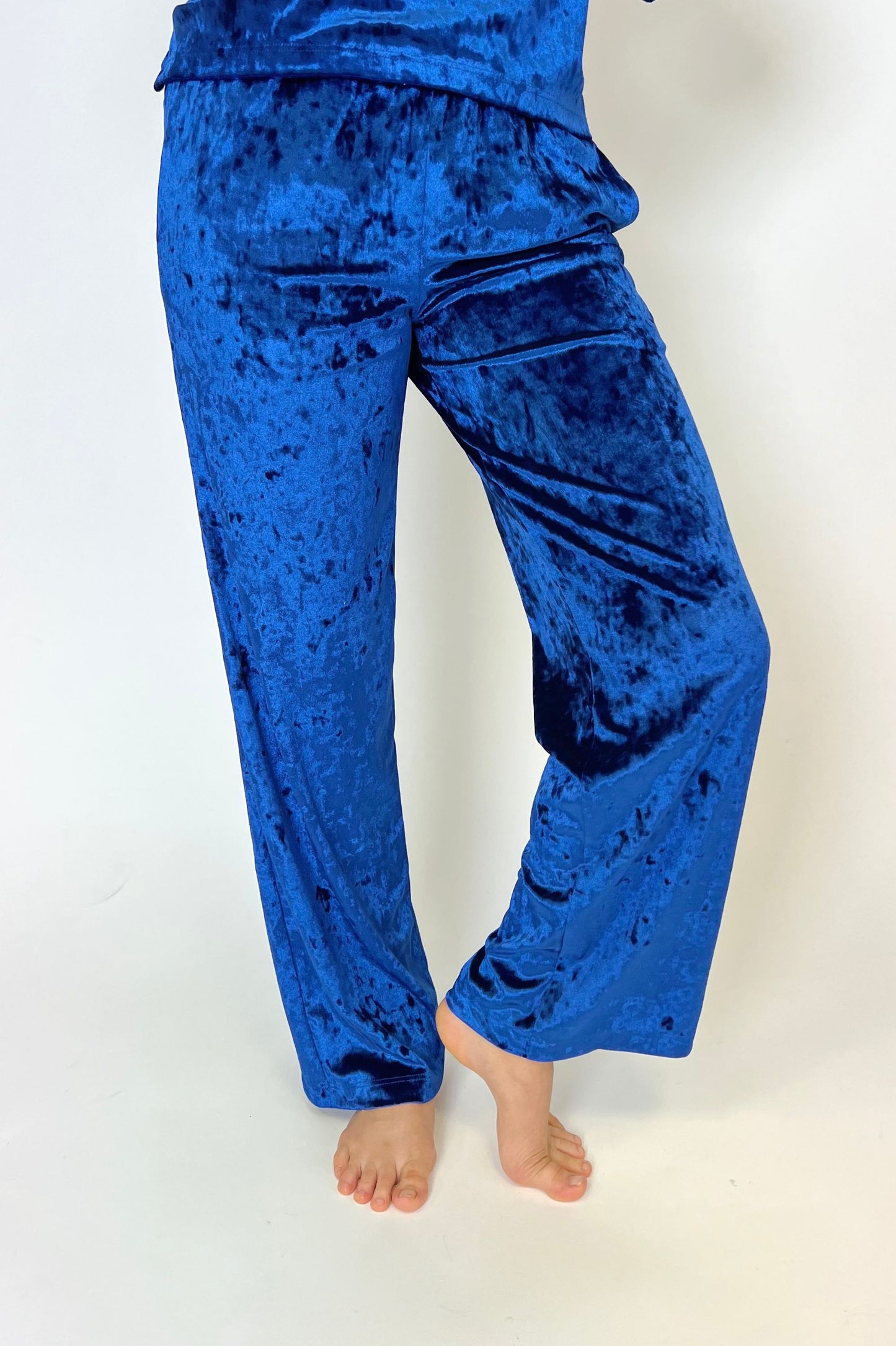 Bright blue velvet trousers with pockets