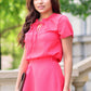 Coral blouse with ribbon in front